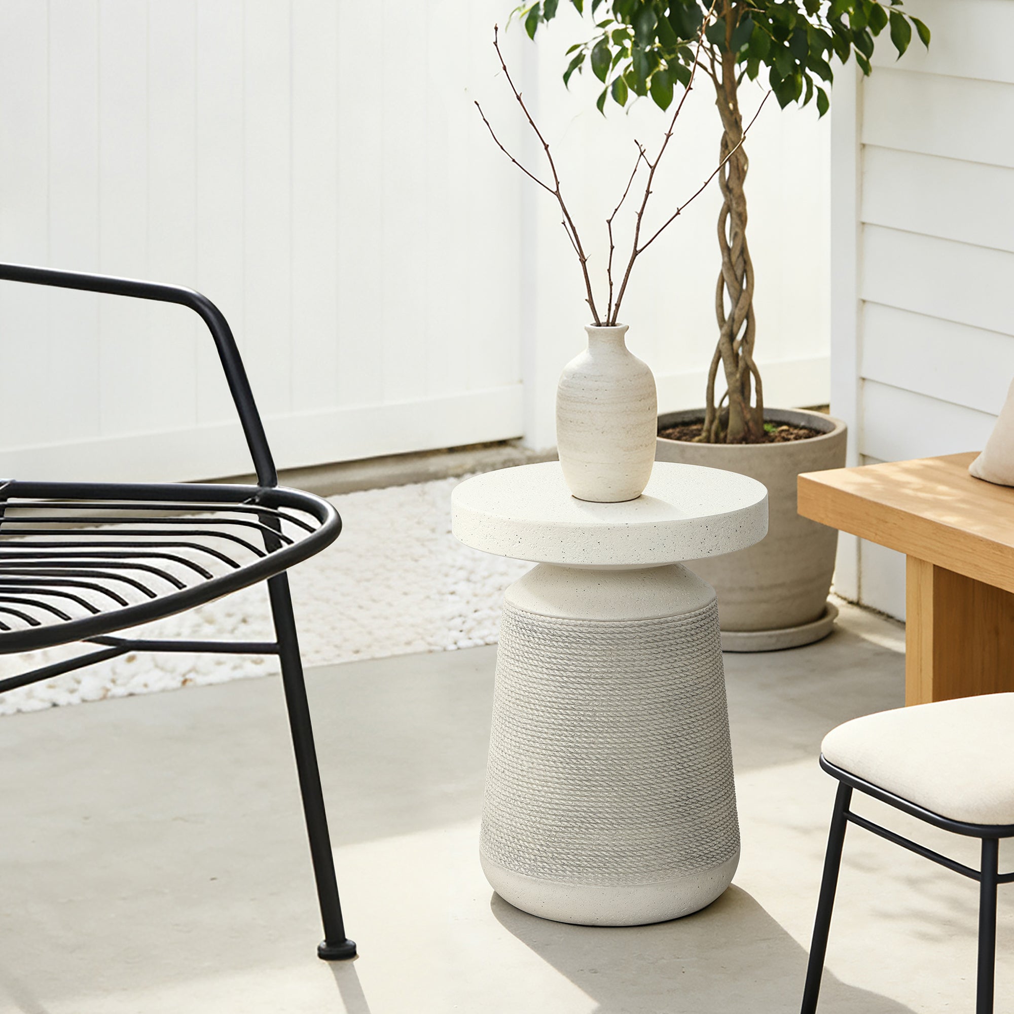 Textured Faux Stone Patio Table, Japandi Style with Sculpted Rope-Look Base